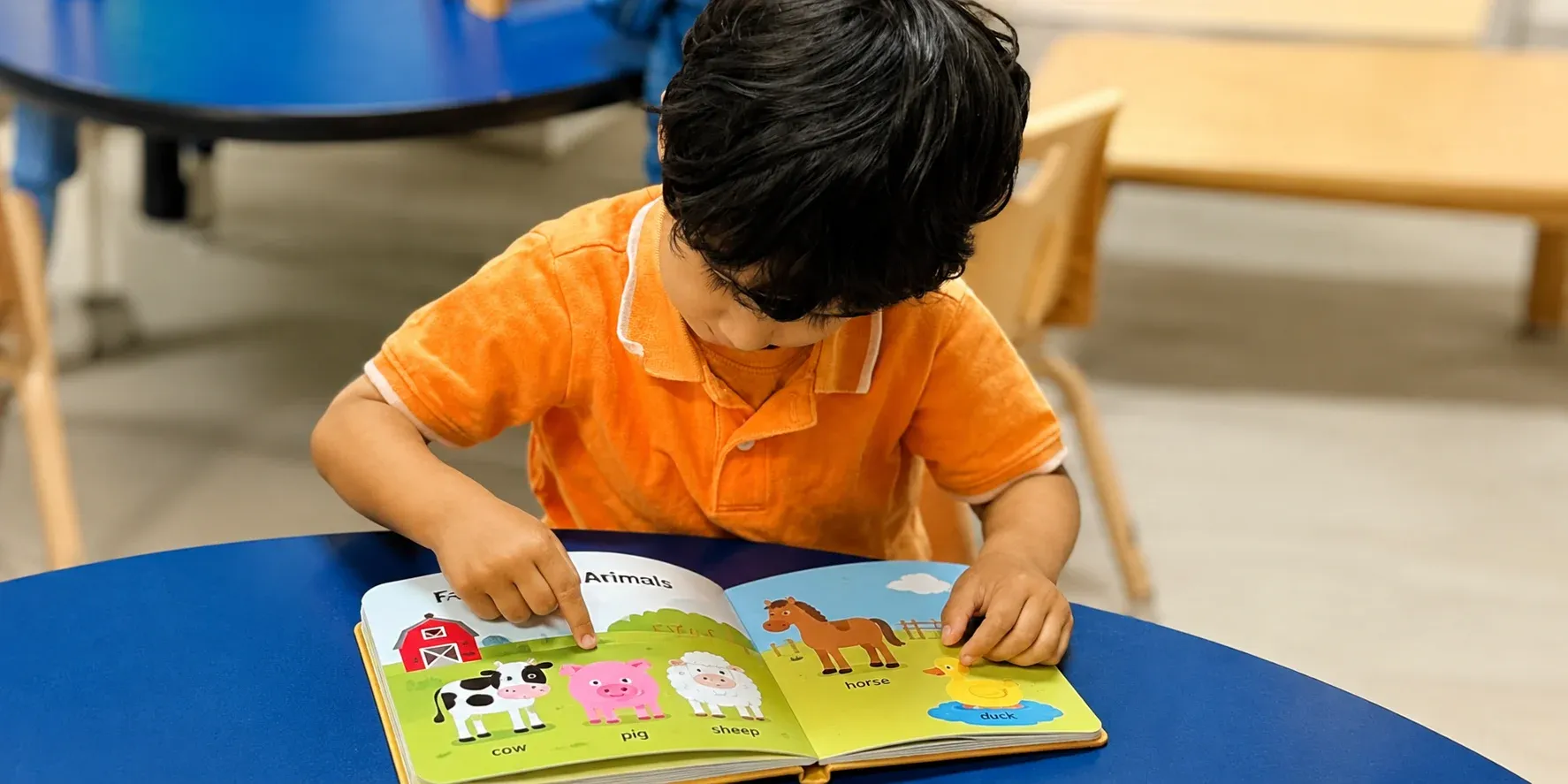 Children building early literacy skills together